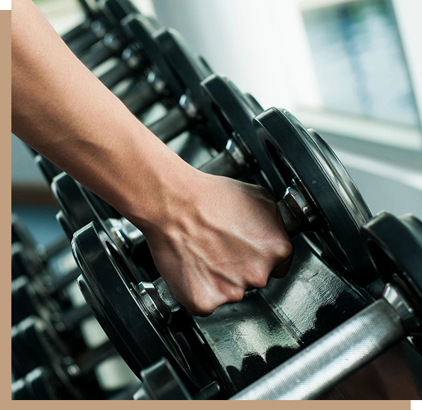 A person is holding onto some weight plates