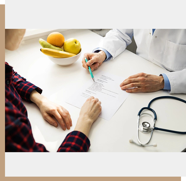 A doctor and patient sitting at a table