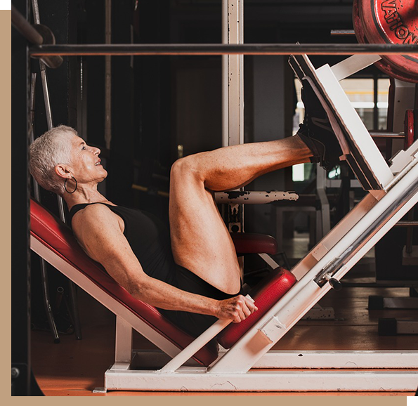 A man is working out on the leg press machine.